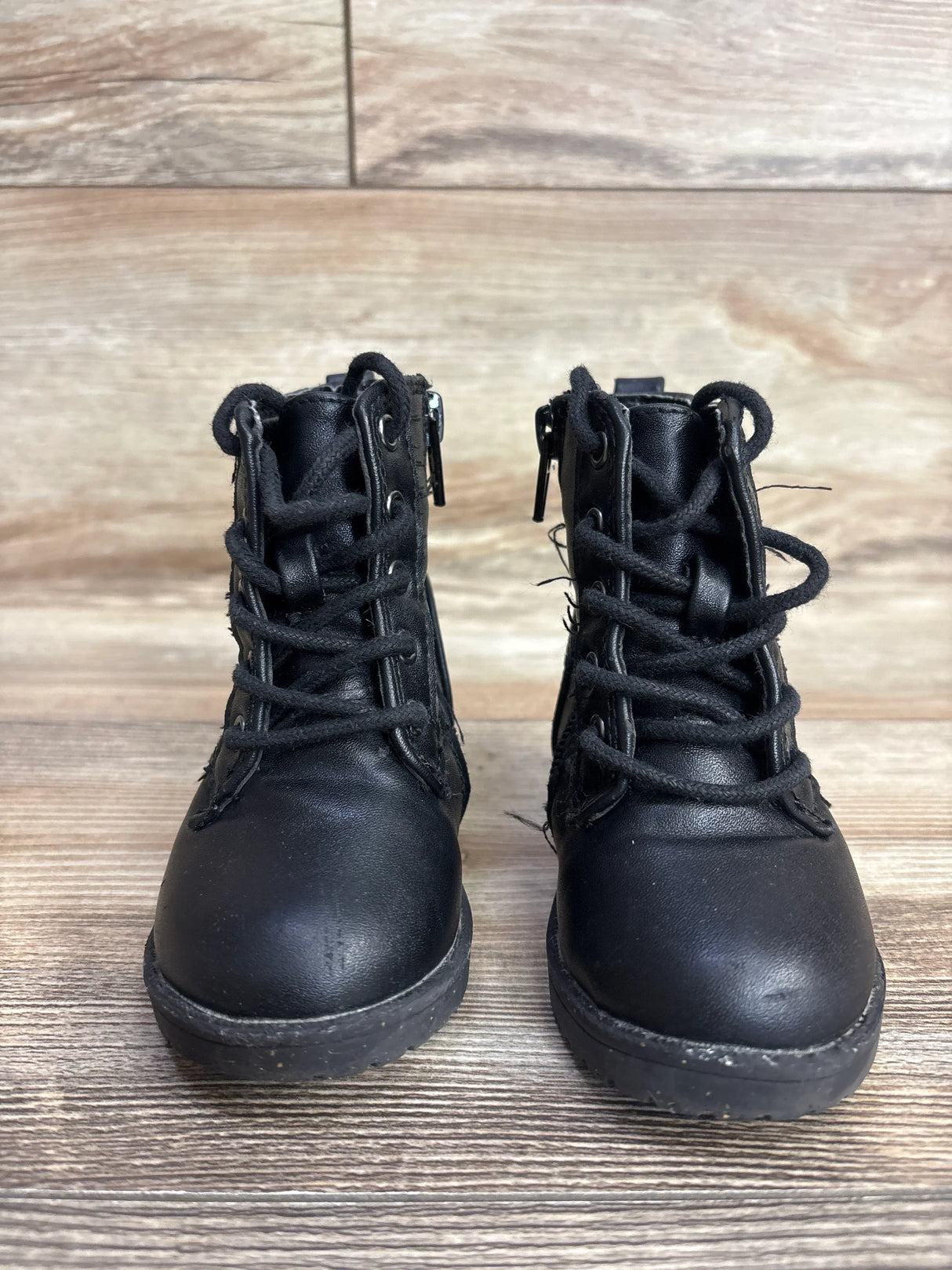 Front view of Sugar Faux Leather Butterfly toddler boots size 5C showing lace-up fronts and side zippers on wooden floor