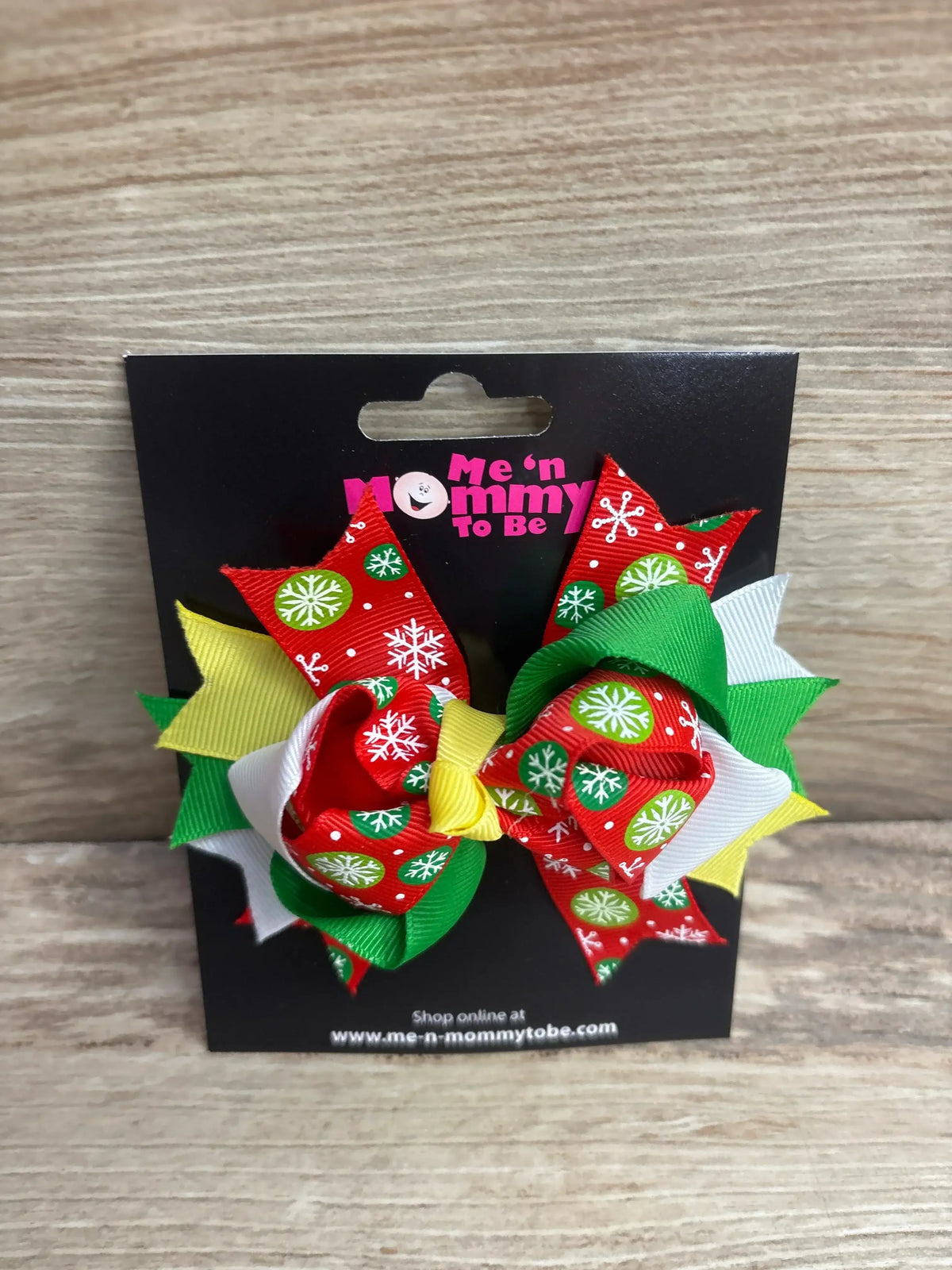Festive red, green, and white snowflake hair bows for kids, perfect for holiday outfits and Christmas celebrations.