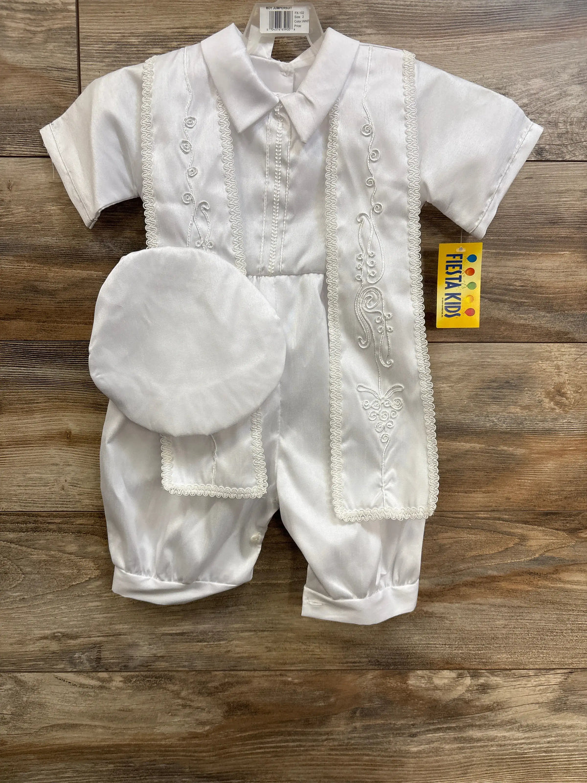 Front view of white Fiesta Kids three-piece baptism christening set showcasing embroidered vest, collared romper, and cap