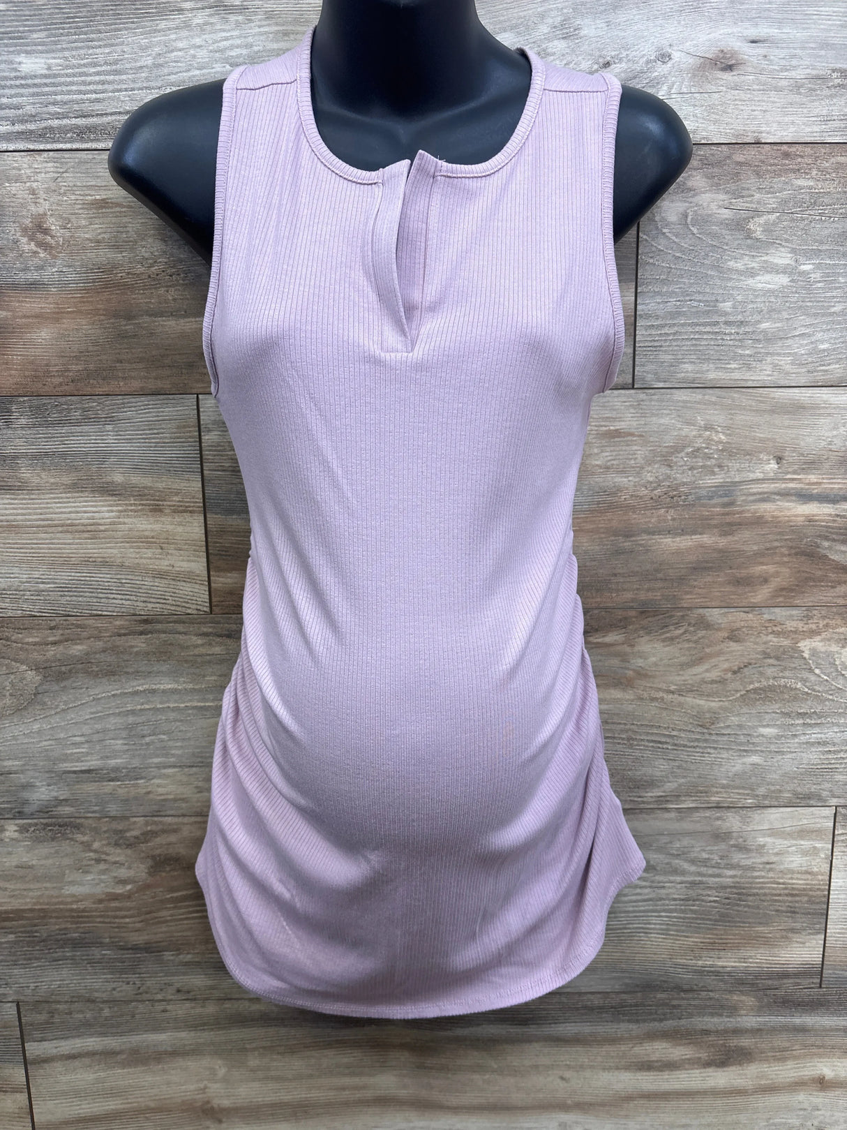 Sleeveless ribbed lavender maternity top on mannequin, wood background