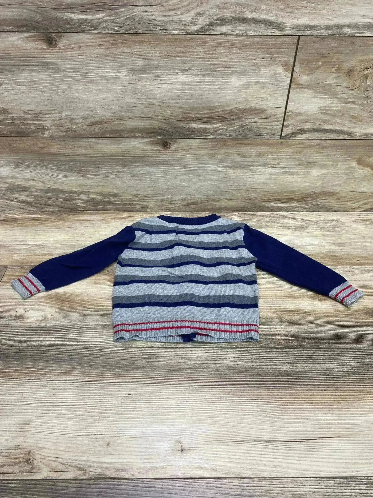 Front view of Andy & Evan toddler cardigan in navy and grey showing button closure and ribbed cuffs on white background