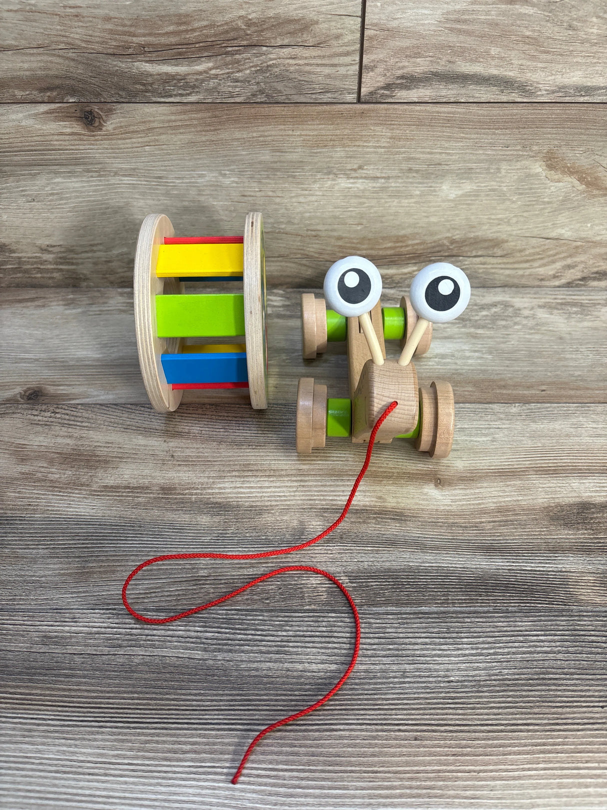 Hape Walk-A-Long Snail Shape Sorting Pull Toy
