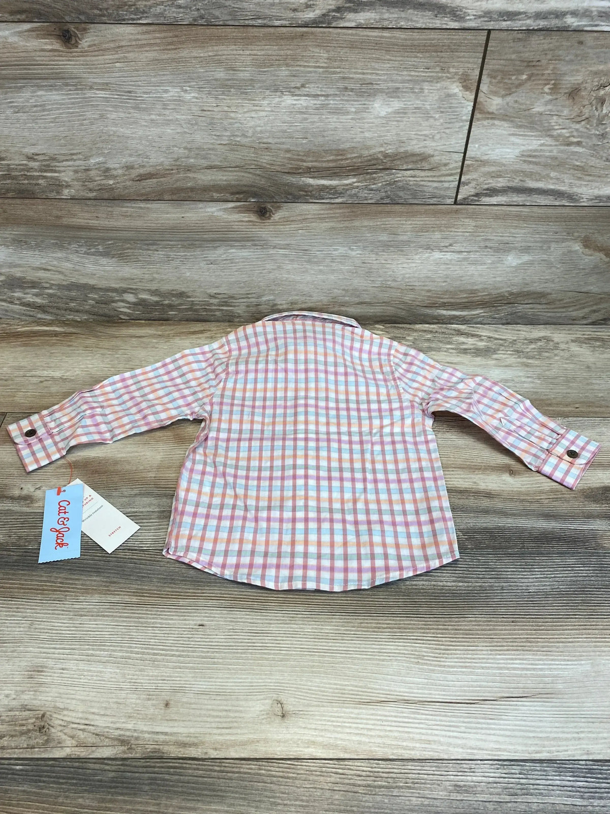 Back view of NEW Cat & Jack Plaid Button-Up Shirt, pink size 18m, showcasing long sleeves and button cuffs on a wood background