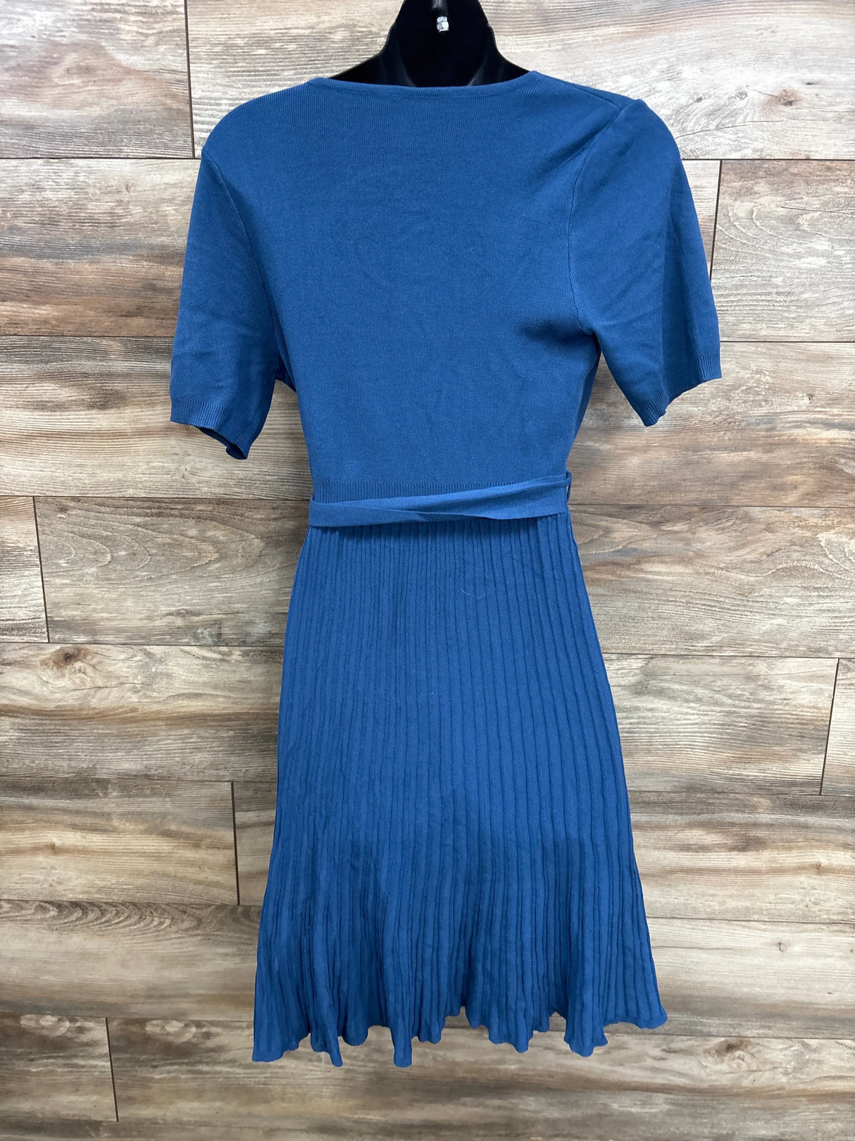 Blue maternity dress with short sleeves, ribbed knit, and pleated skirt for expectant moms