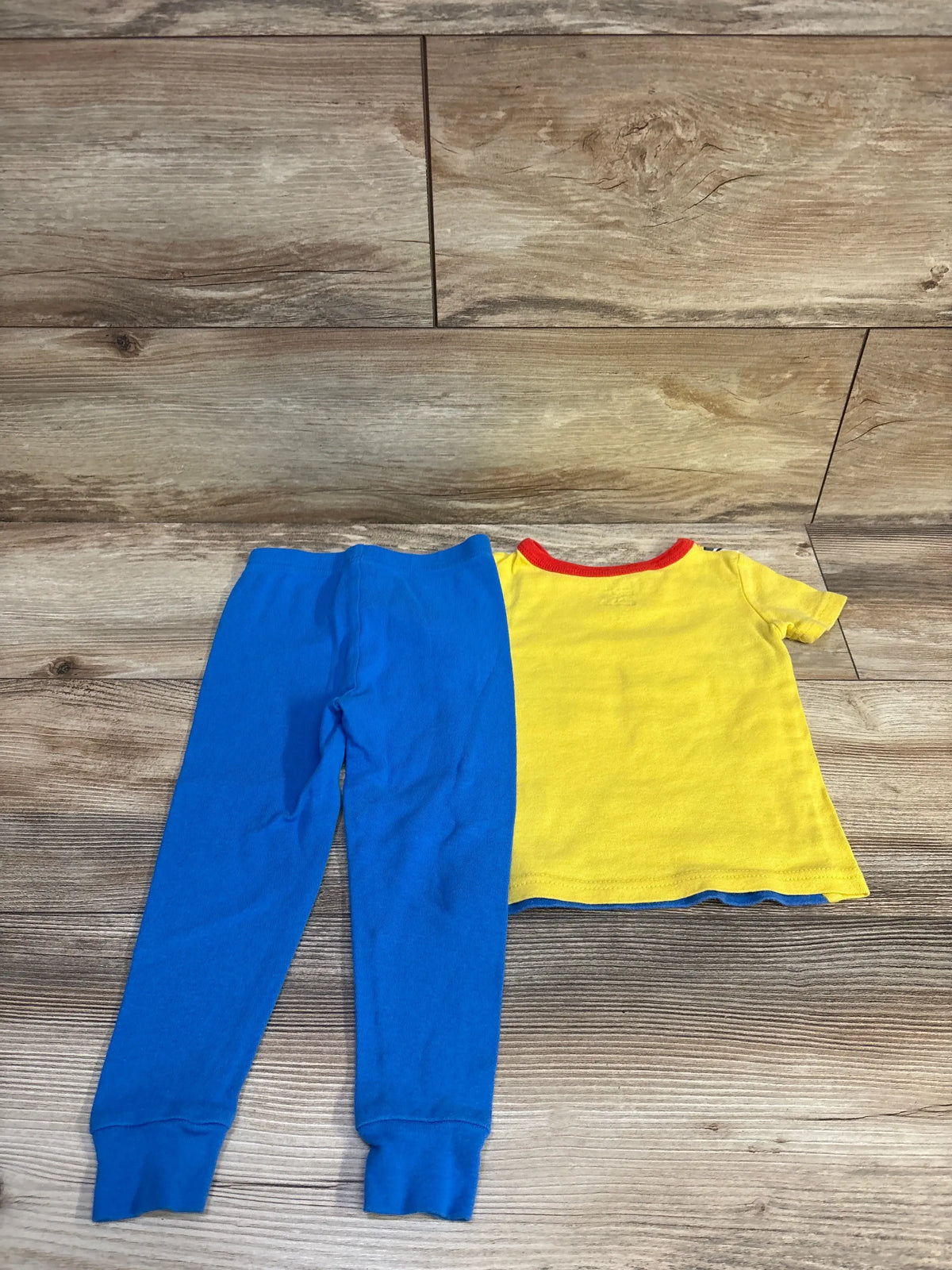 Disney Pixar Toy Story 2-piece pajama set with yellow t-shirt and blue pants, size 2T