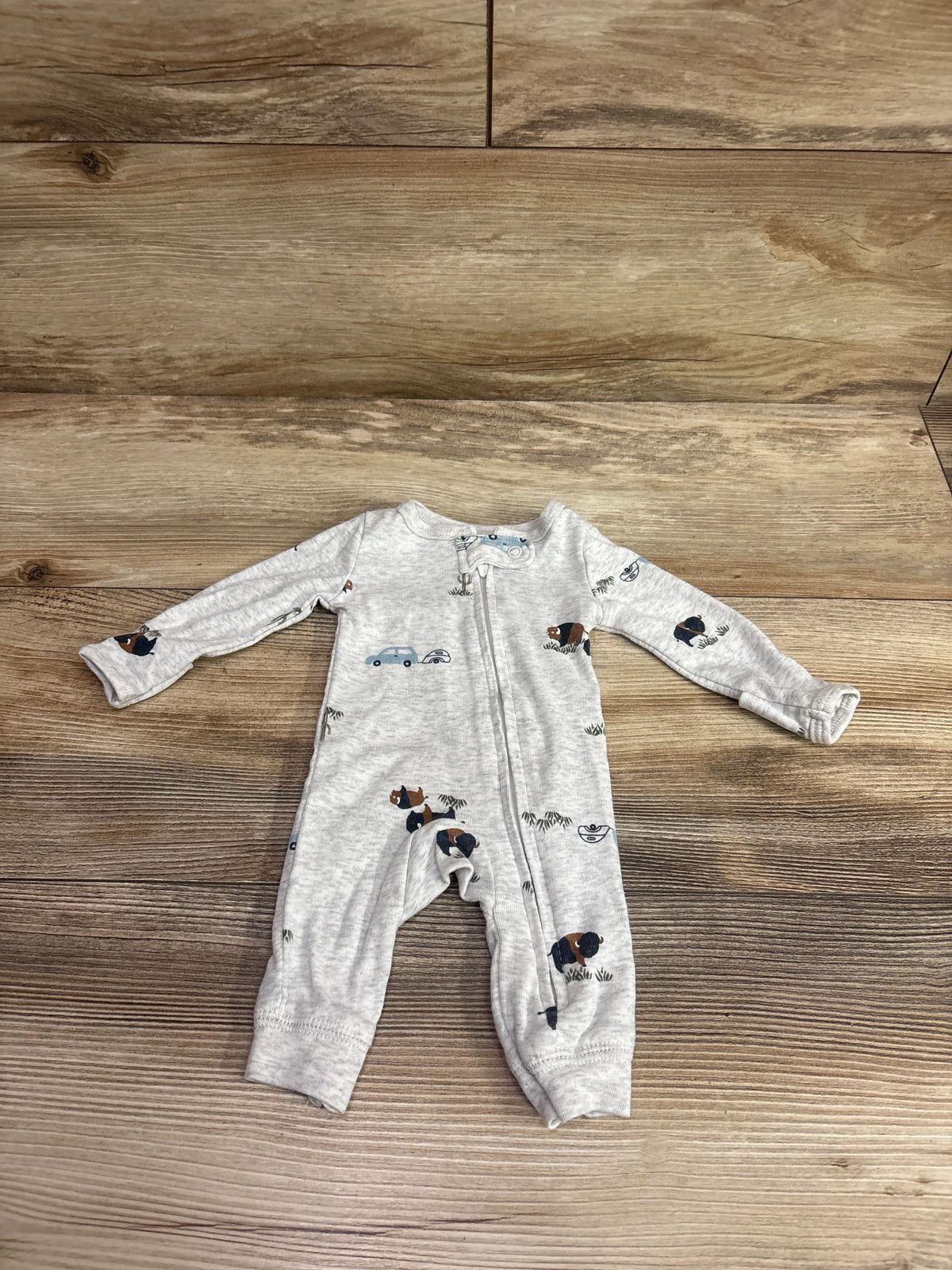 Carter's grey preemie footless sleeper with cute car and dog prints on a wooden background