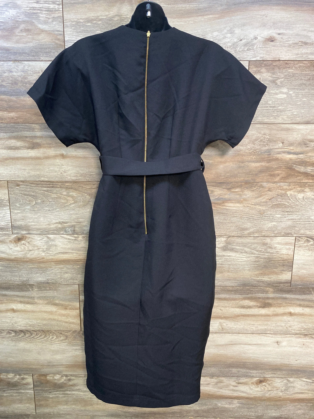 Black belted midi dress with short sleeves and gold back zipper on mannequin