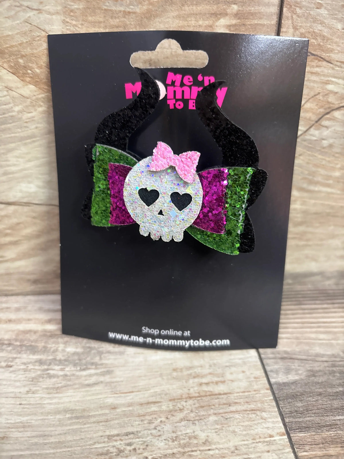Green and purple glitter hair bow with a skull applique and pink bow, by Me n Mommy To Be