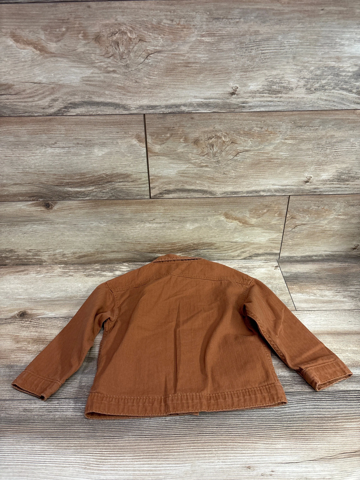 Modern Moments brown button up shirt for toddlers size 3T on a rustic wood background