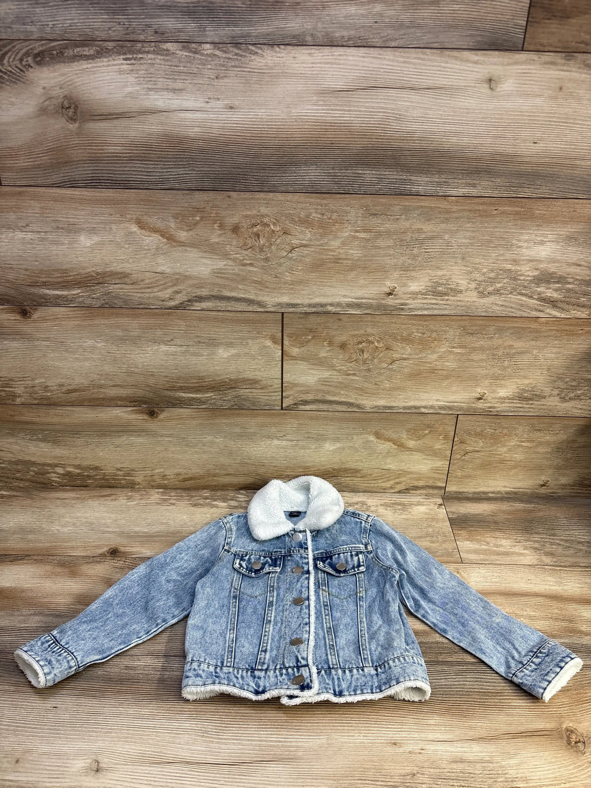 Front flat-lay of Shein toddler denim jacket size 5T showcasing white sherpa collar and lining and button-front on wood background