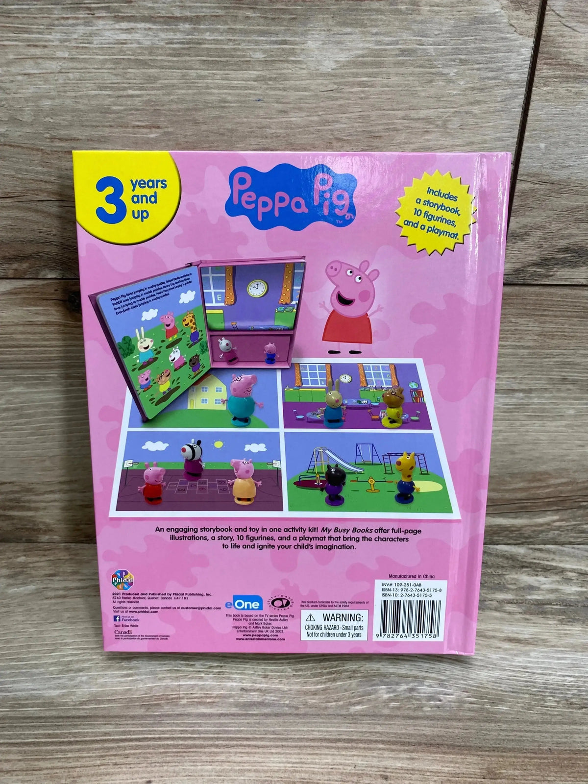 Rear view of Peppa Pig My Busy Books 3+ box showcasing toy figurines and playmat illustrations on a wooden floor background