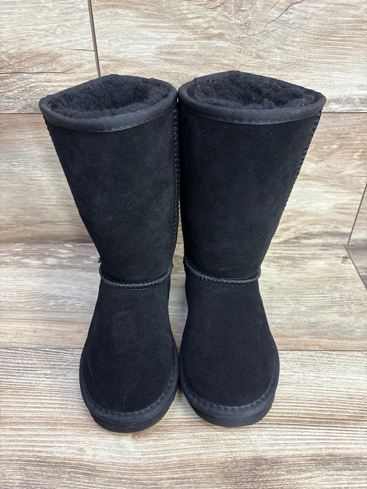 Front view of Bearpaw Kenzie Tall Wool Lined Boots size 12c in black suede with fleece lining at top on wood plank floor