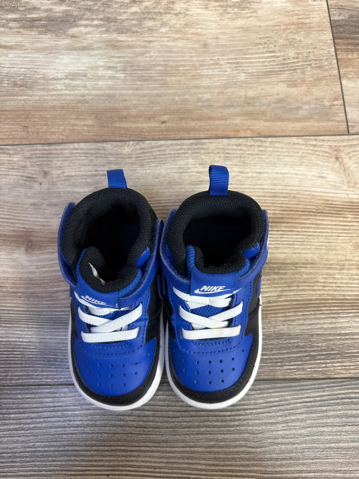 Top view of Nike Court Borough Mid 2 Recraft TD sneakers in Game Royal Blue and Black, size 5c.