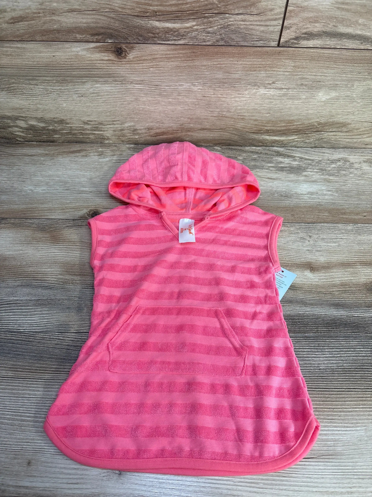 Flat lay of pink striped hooded swim cover-up size 12 months with kangaroo pocket on light wood background