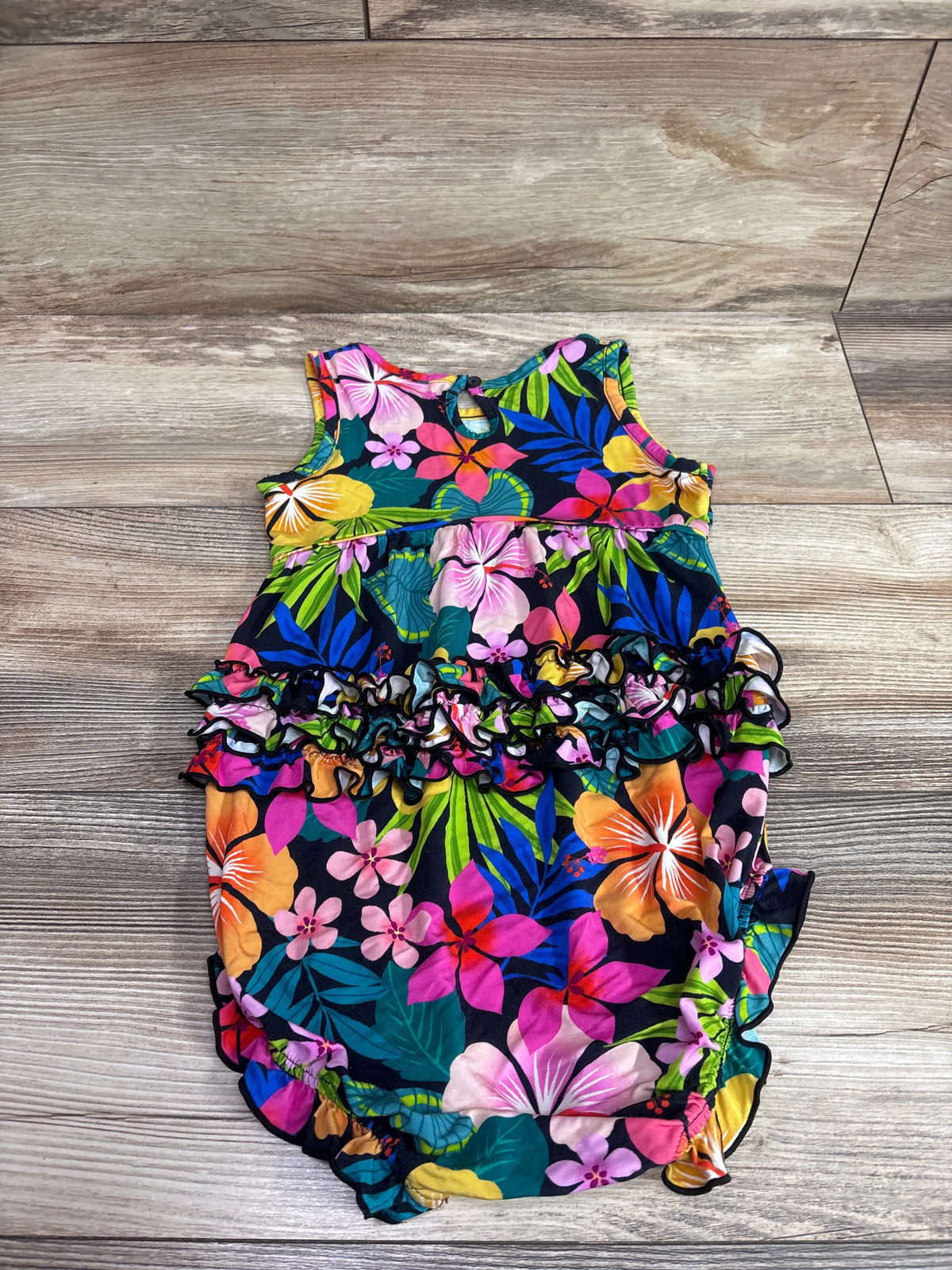Top view of Play by Little Sleepies Jungle Blooms bubble romper with floral print and layered ruffles
