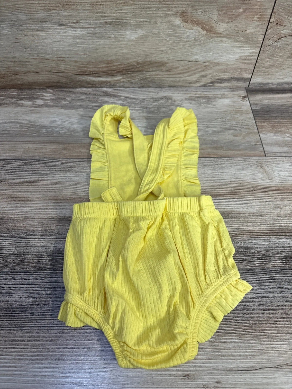 Front view of Cat & Jack girls’ yellow ribbed bubble romper (12 months) showing bubble legs on white background