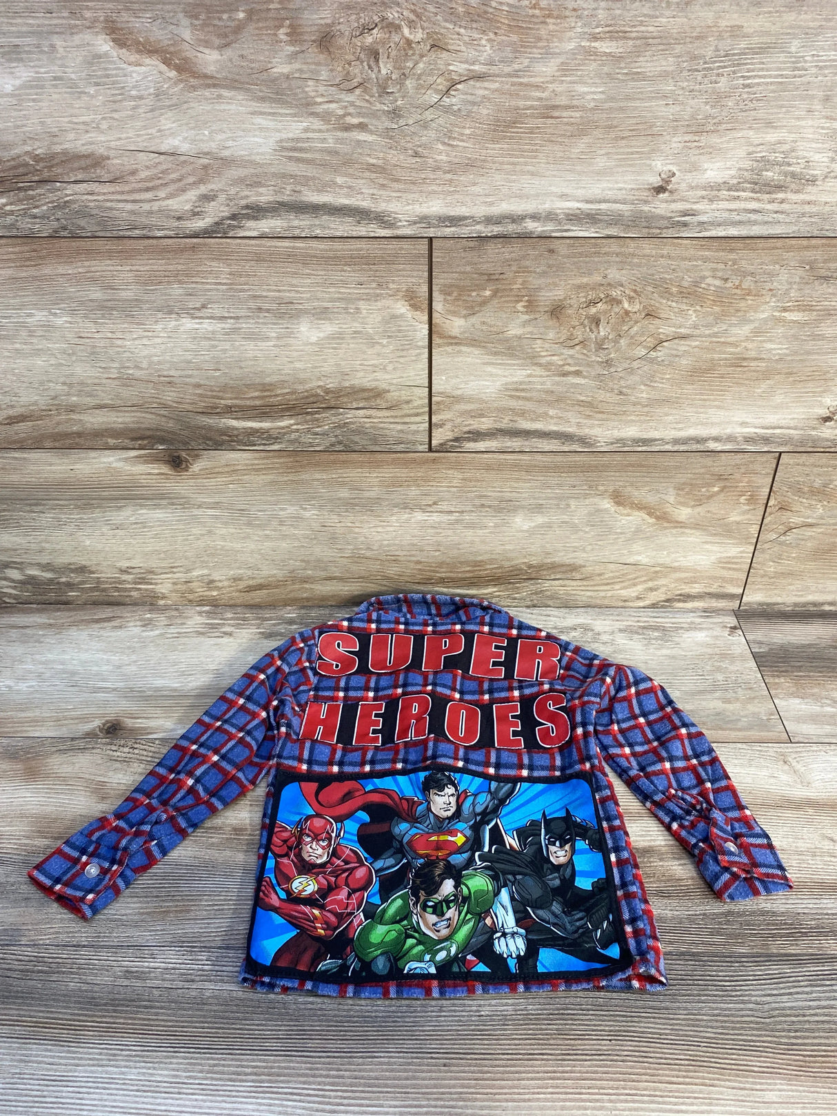 Blue and red plaid shirt with bold red SUPER HEROES text and DC comic characters Flash, Superman, Green Lantern, and Batman