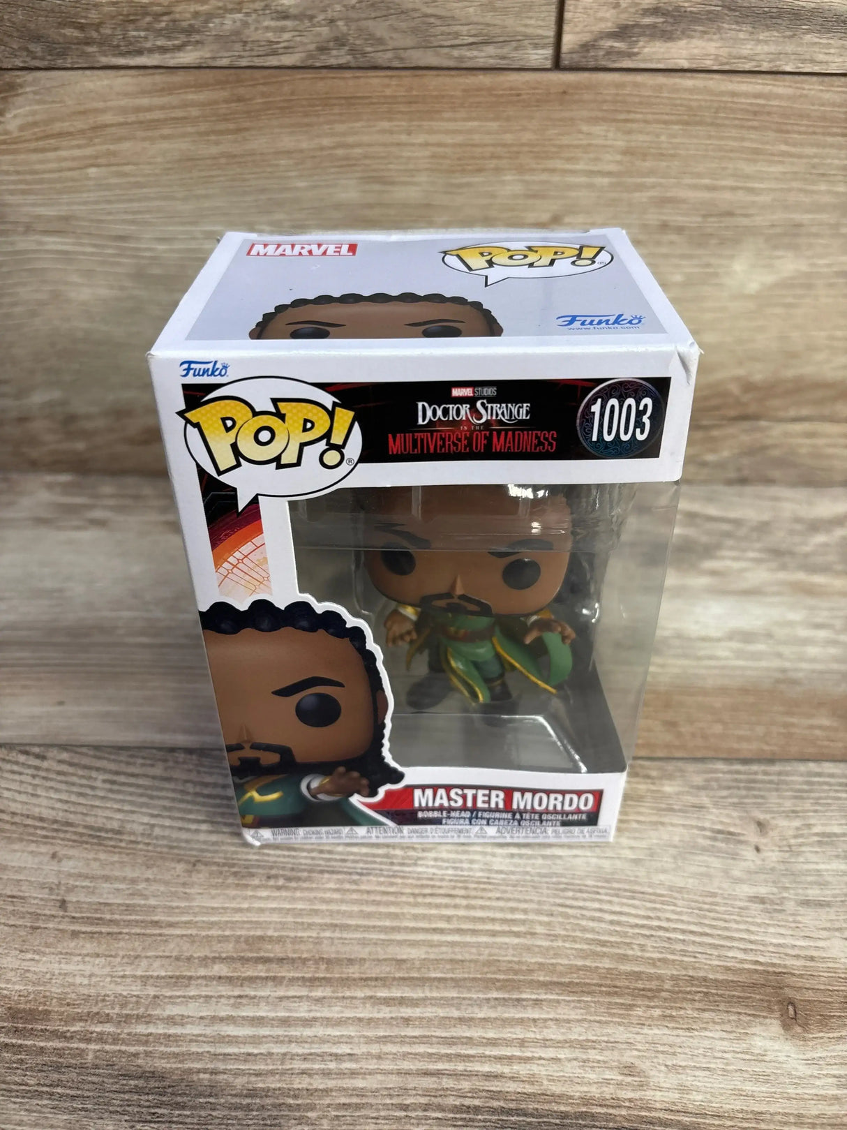 Front three-quarter view of boxed Funko Pop Master Mordo from Doctor Strange showing windowed box on wood surface
