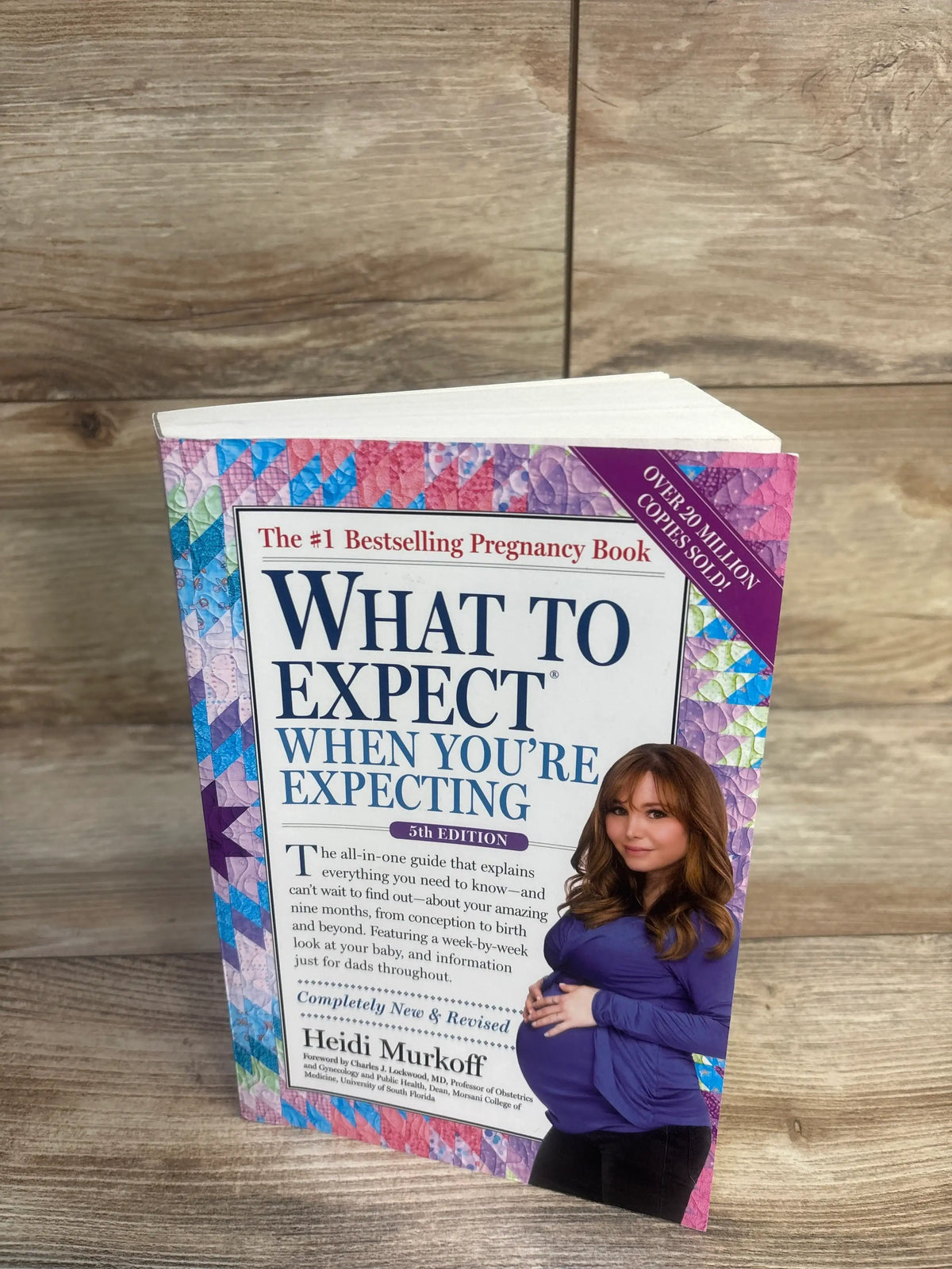 Front view of What to Expect When You’re Expecting 5th Edition paperback showcasing colorful cover and pregnant woman
