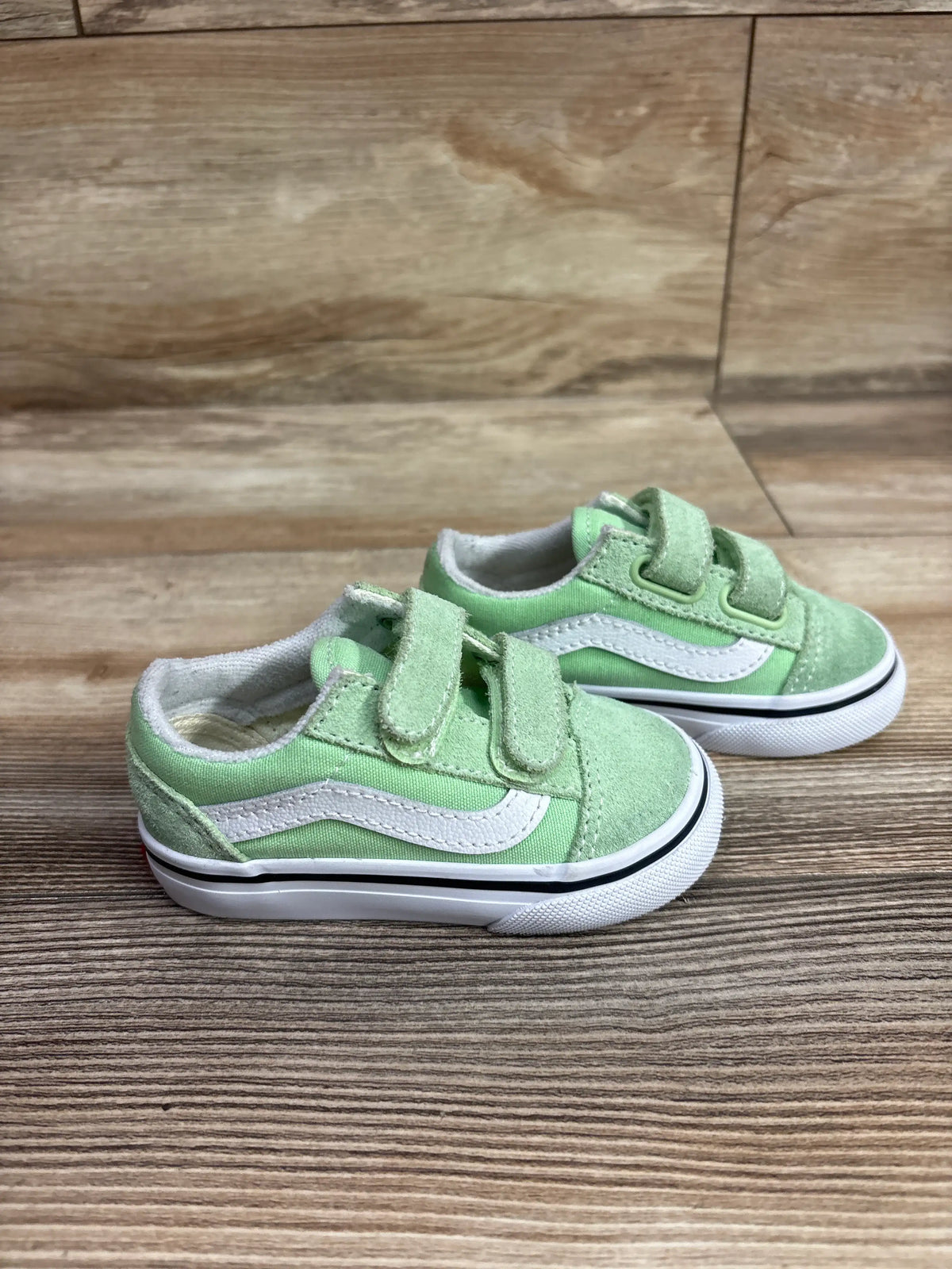 Pair of lime burst green Me n Mommy To Be sneakers with white stripes and velcro straps.
