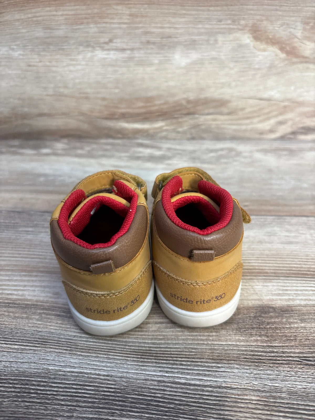 Rear view of Stride Rite 360 Indiana Honey Yellow sneaker boots, size 6C, showcasing red lining and white soles