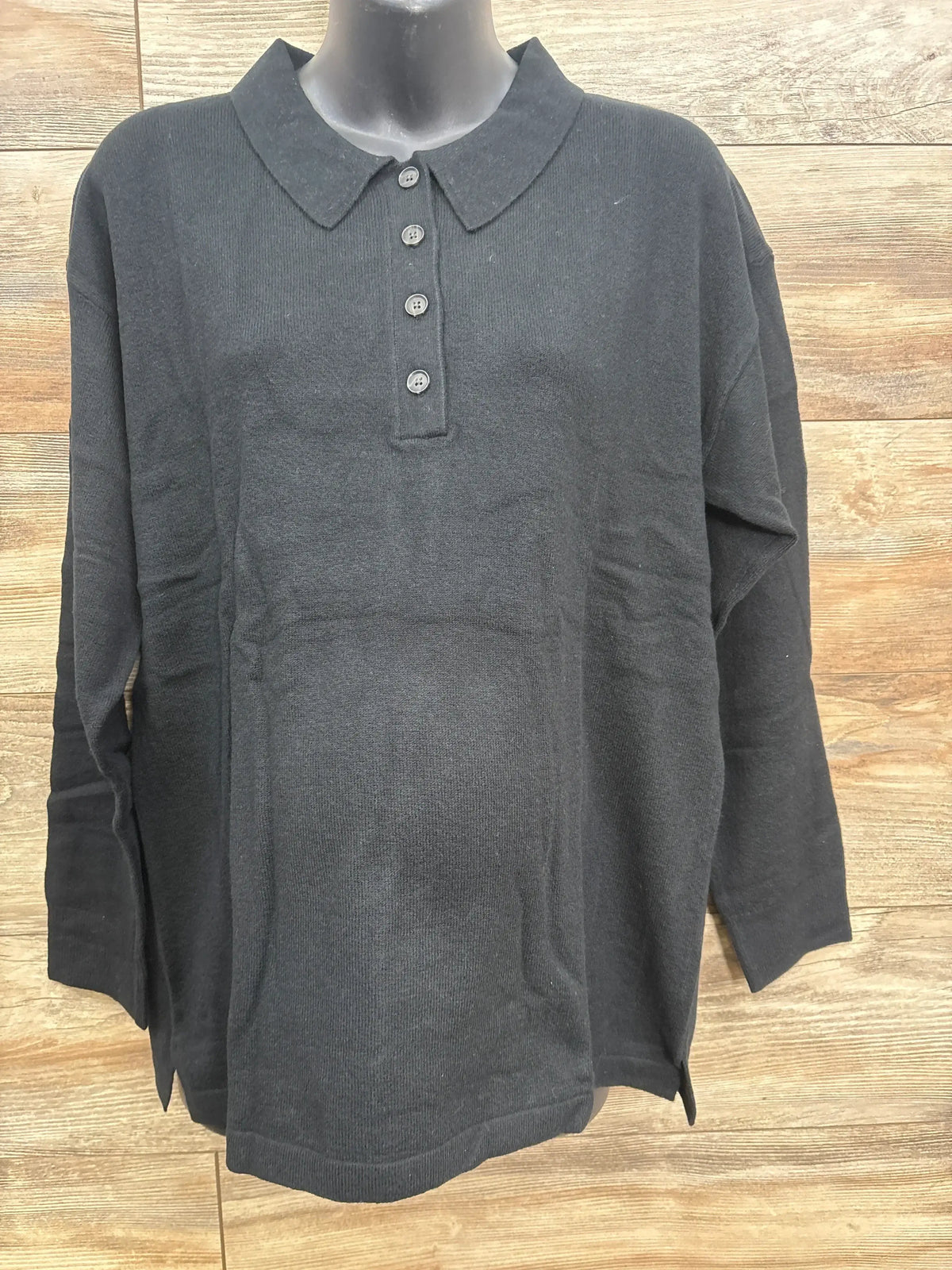 Front view of Gap CashSoft maternity polo sweater in black, size large, showcasing four-button placket, long sleeves and relaxed fit on mannequin with wood background