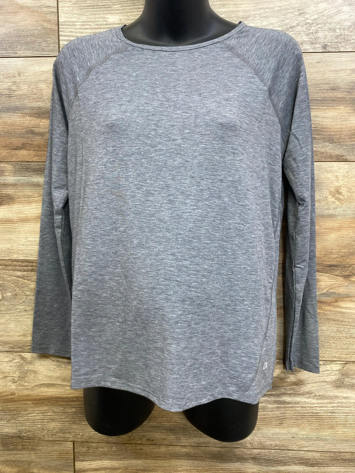 Front view of grey Gap maternity long sleeve Breathe shirt, size small, showing raglan sleeves and heathered knit on wood background