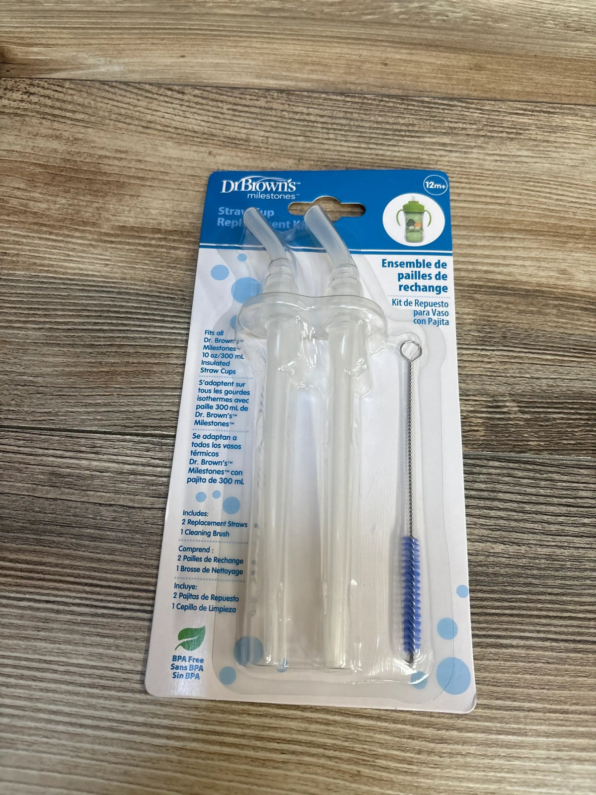 Top view of Dr. Brown’s replacement straw kit showing two silicone straws and a cleaning brush on a white background