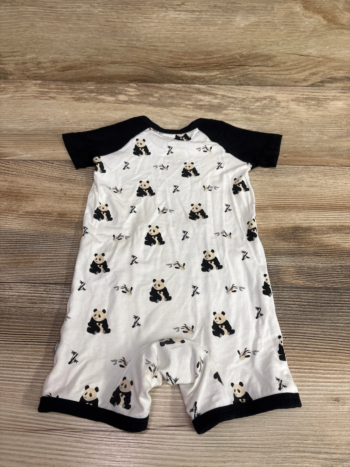 Kyte Baby bamboo panda shortie romper in white with black trim and panda print