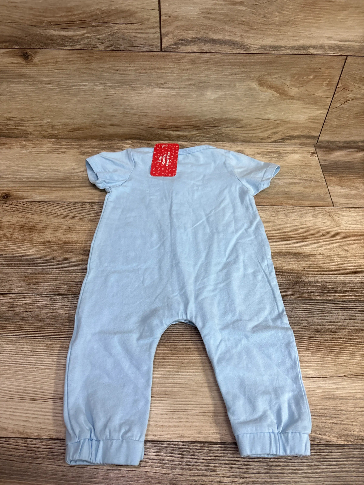 New light blue PatPat Mini Boss baby jumpsuit size 6-9m on a wooden background