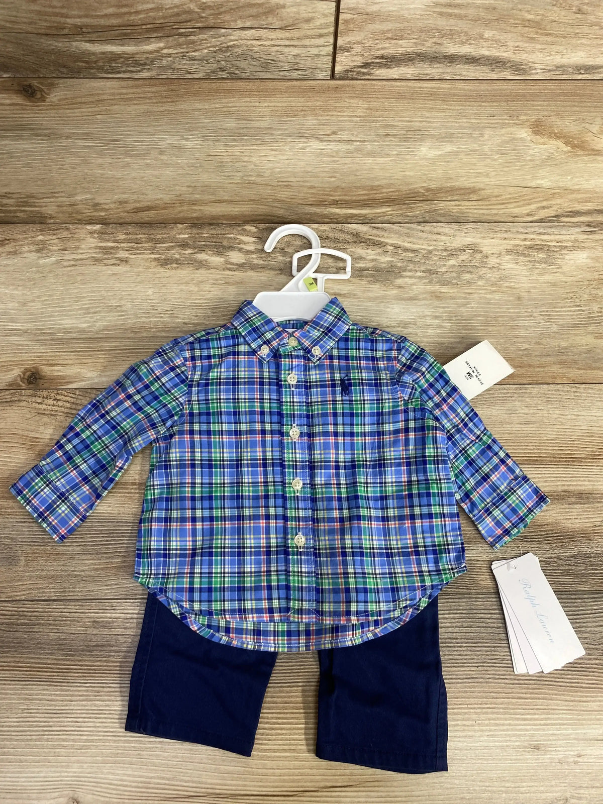 Toddler's Ralph Lauren blue green plaid button-up shirt with navy pants on wooden floor