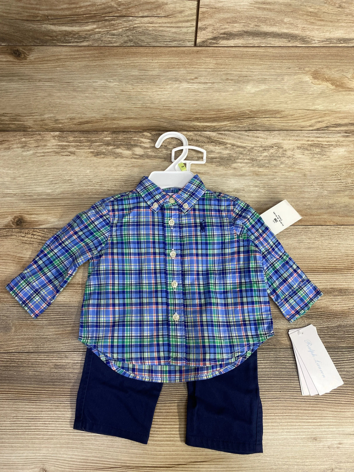 Toddler's Ralph Lauren blue green plaid button-up shirt with navy pants on wooden floor