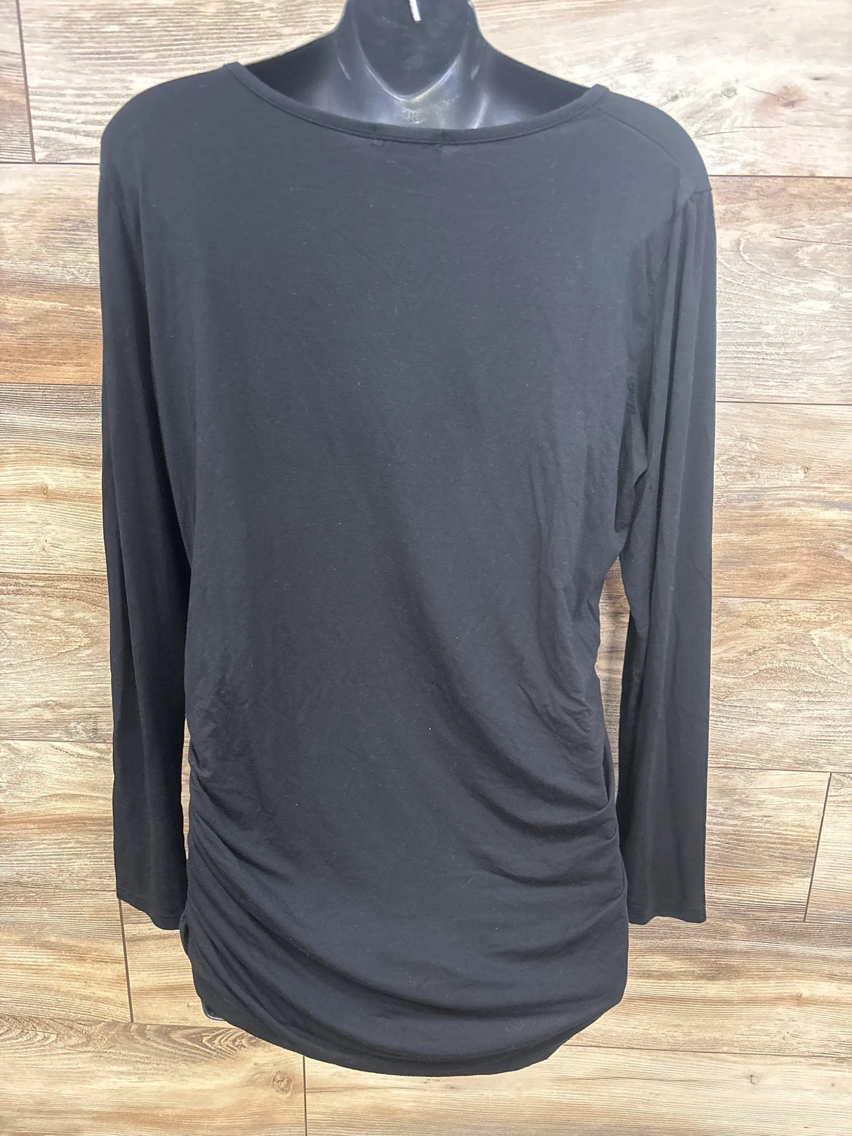 Black long sleeve maternity top with side ruching, displayed on mannequin for resale