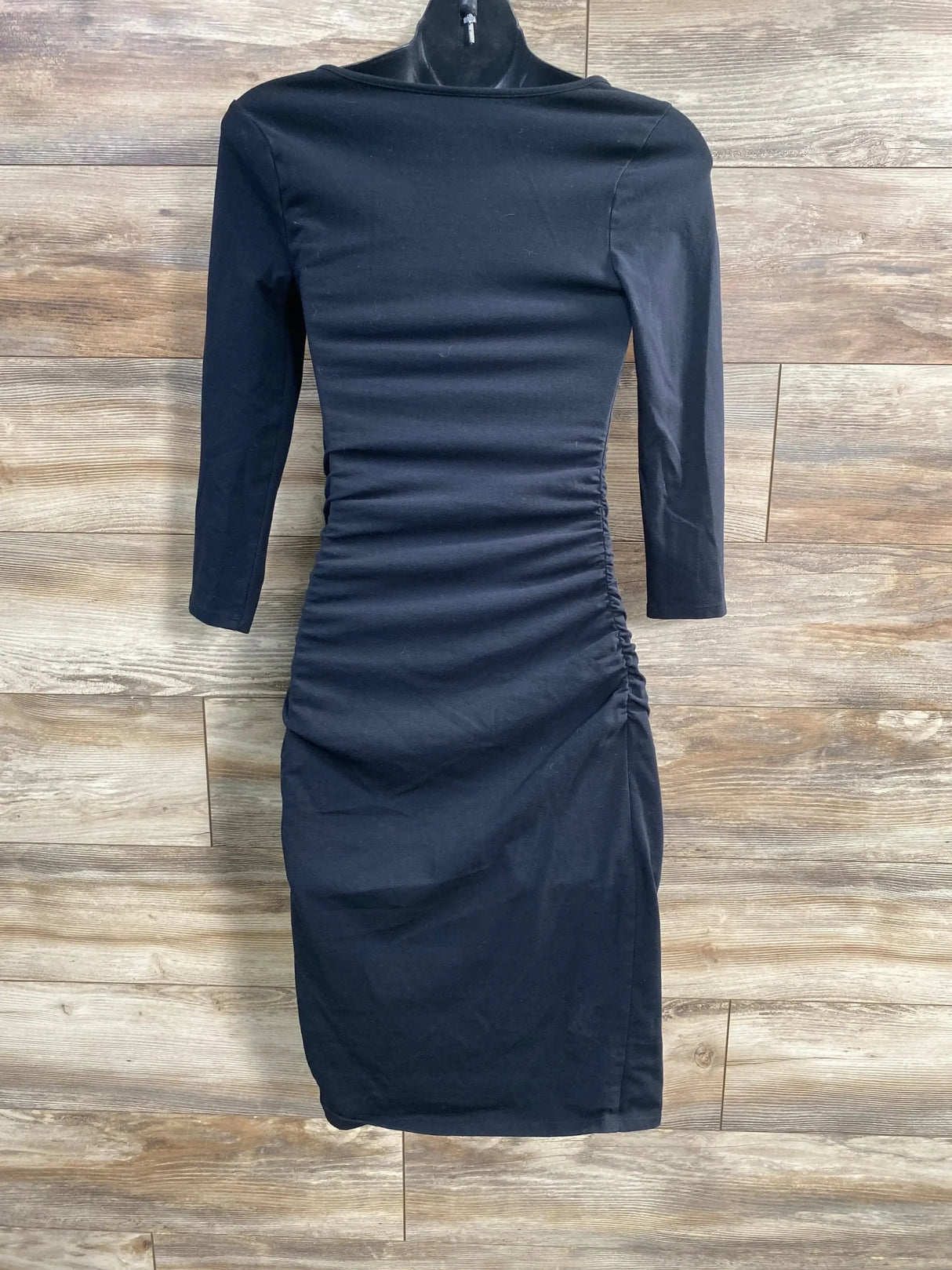 Front view of Isabel maternity solid black bodycon dress showcasing fitted silhouette with plain white background