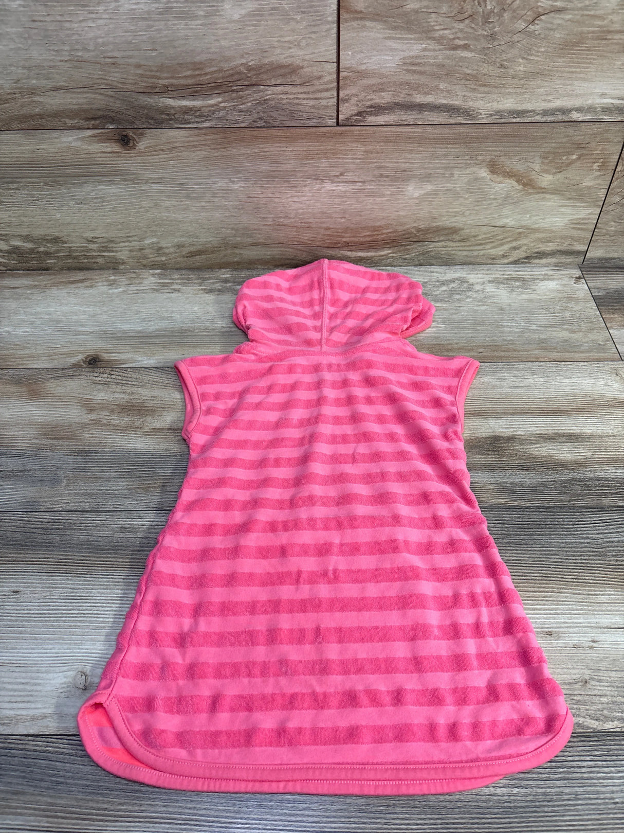 Back view of Cat and Jack terry cloth swim cover up size 2T showing hooded sleeveless pink striped design on wood floor