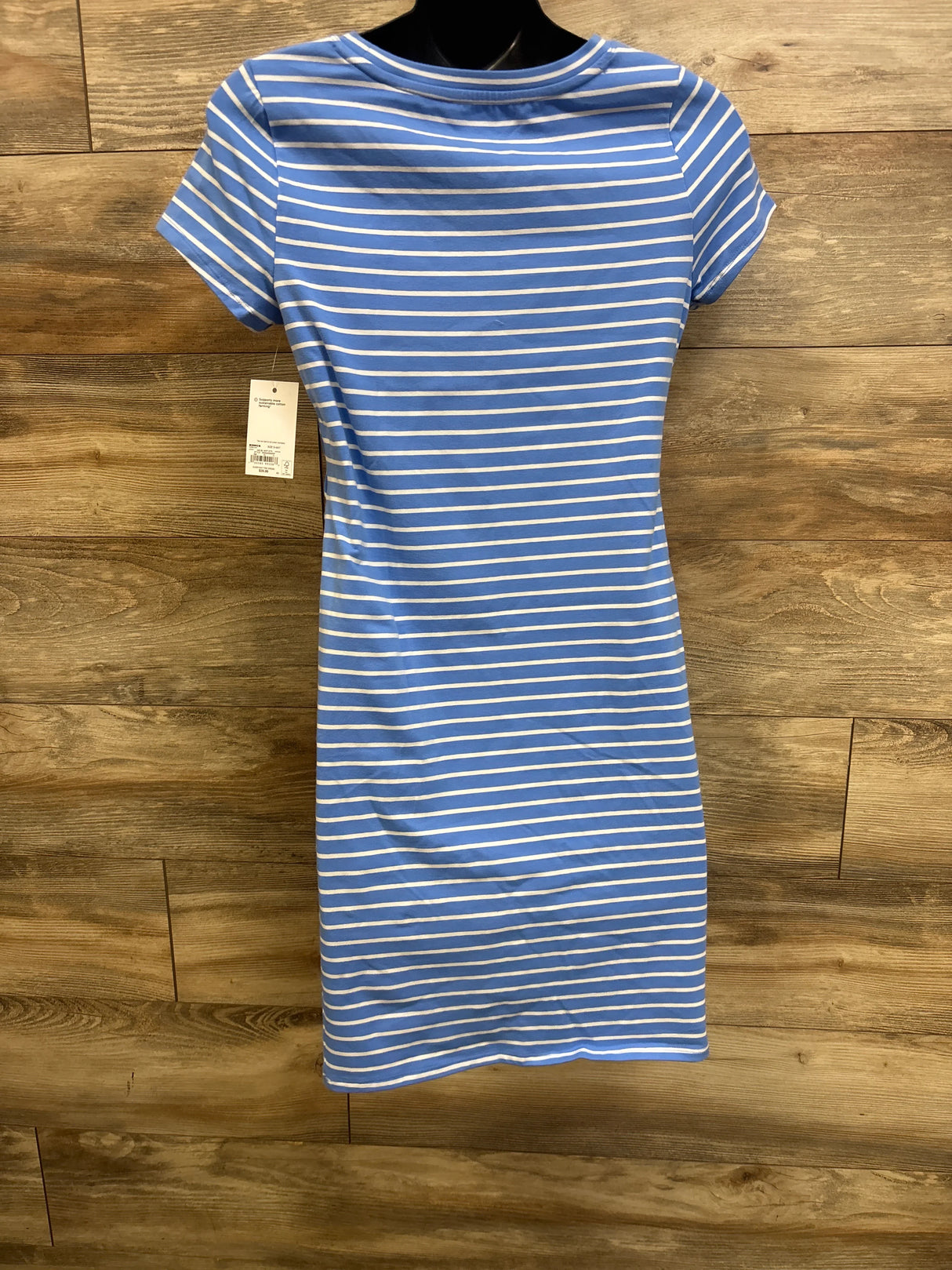 Front view of Sonoma maternity dress with blue and white stripes, short sleeves, crew neckline on mannequin against wood wall