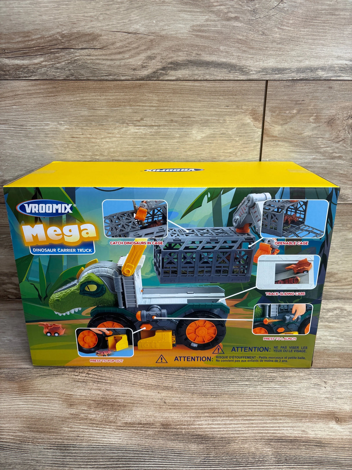 Vroomix Mega Dinosaur Carrier Truck toy with catch cage, openable cage, track sliding cars, and launch feature