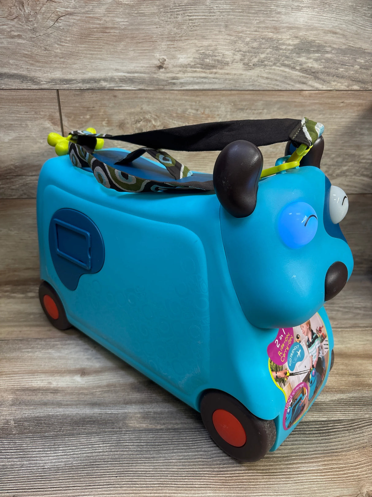 B. toys On The Go Woofer Ride-On Suitcase