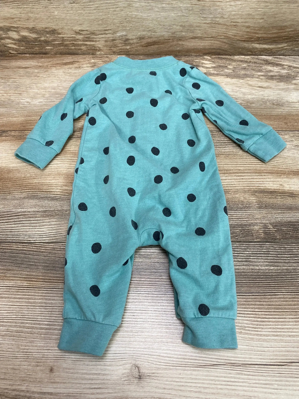Front view of Cat and Jack green polka dot baby coverall (0–3 months) showing snap closures on white background