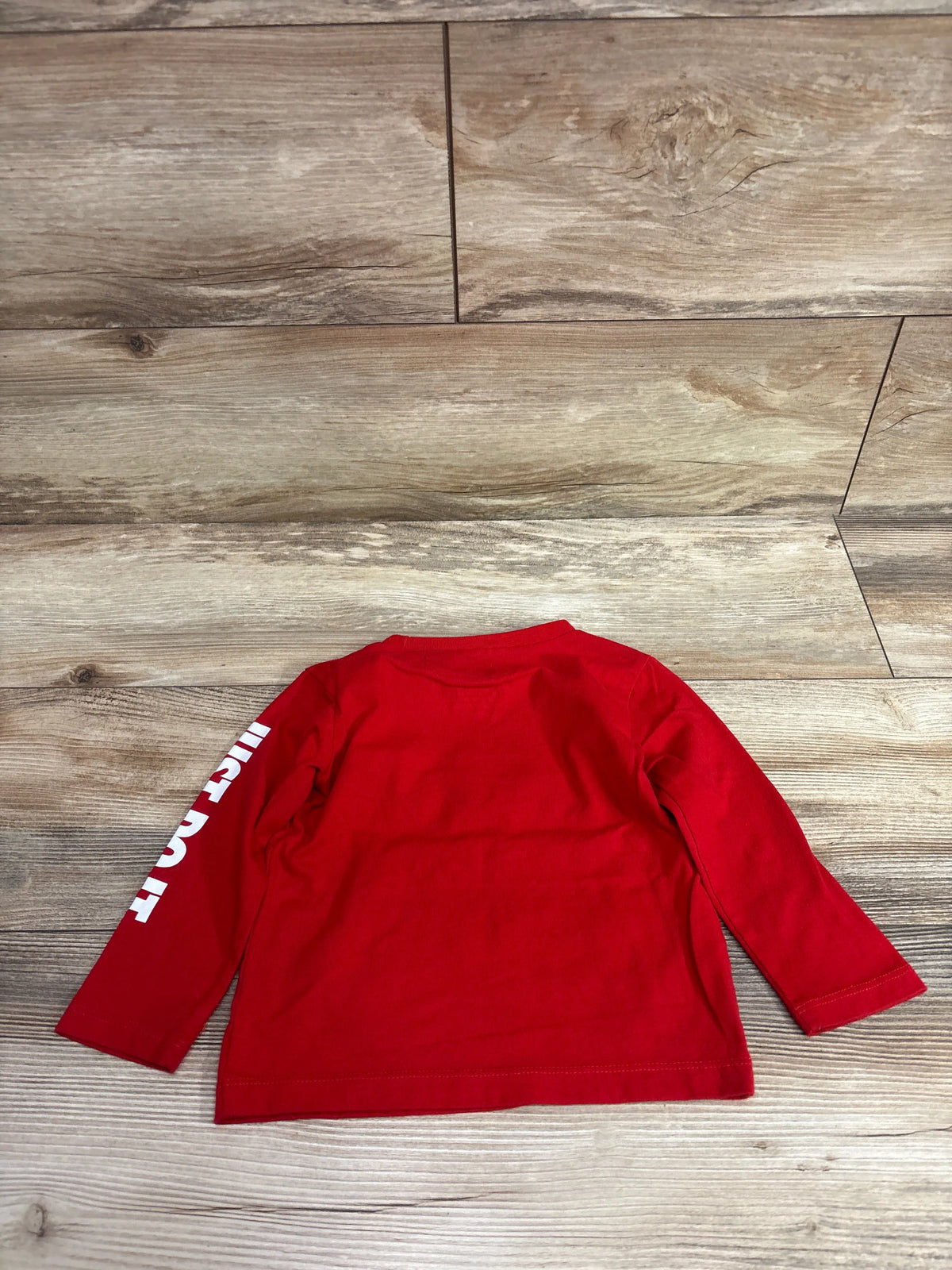Red Nike long sleeve shirt for 18 month old baby with white text on sleeve