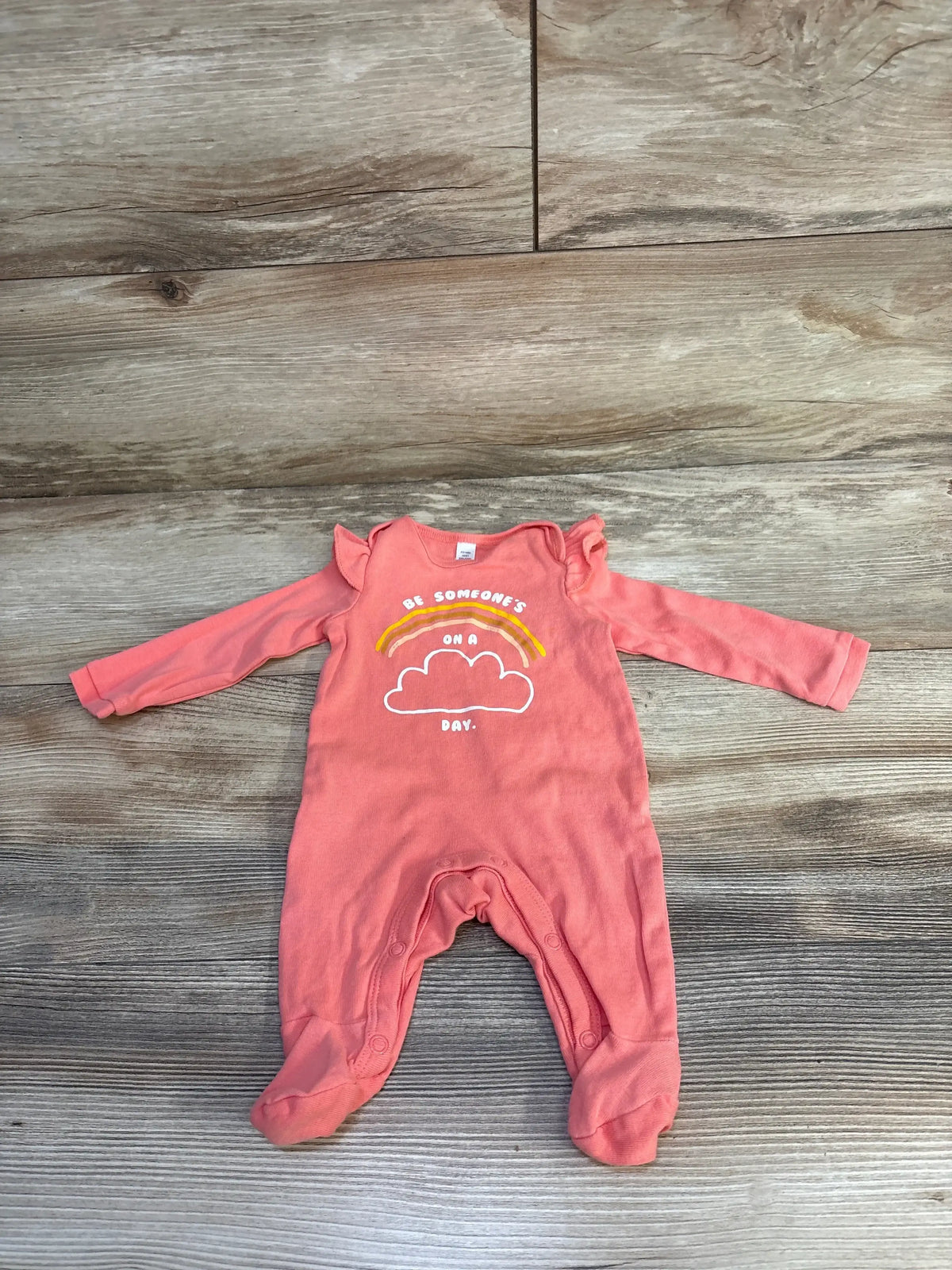 Front view of pink 100% cotton Okie Dokie footed coverall, newborn size, with snap buttons around crotch