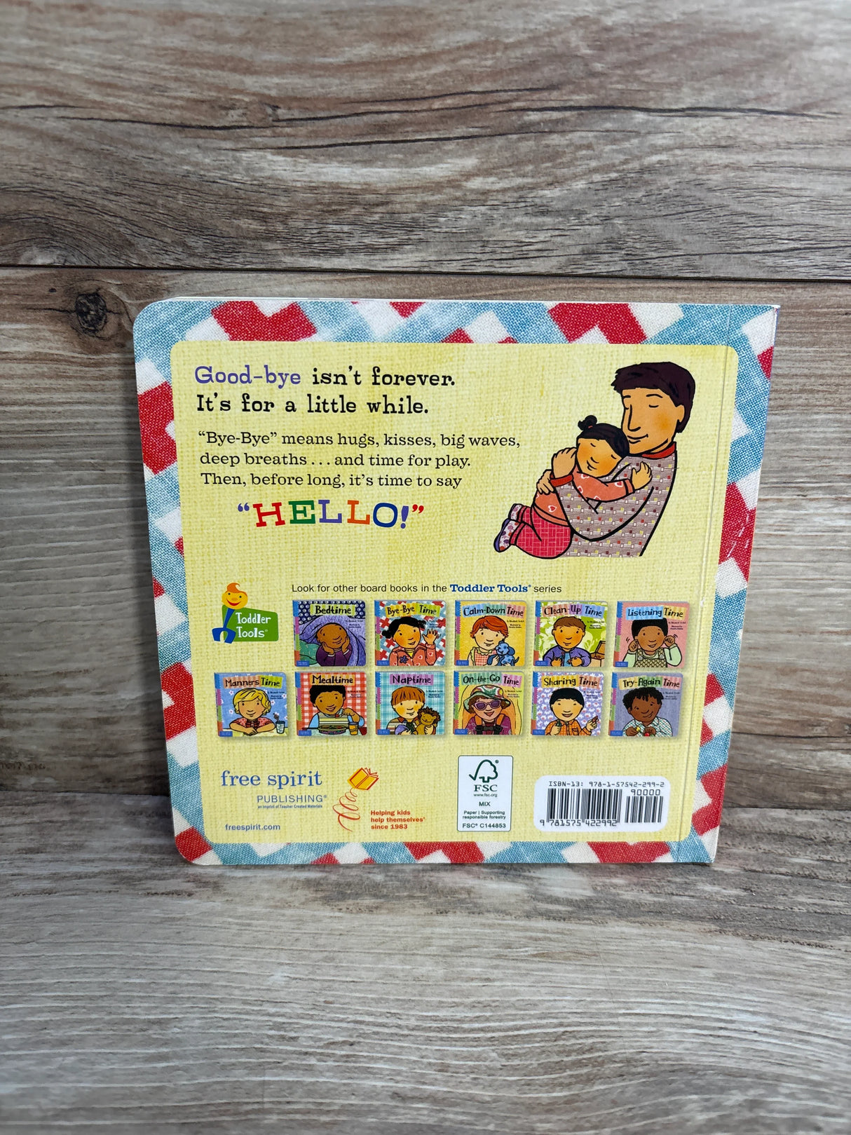 Back cover of a Toddler Tools board book with a father hugging a child, yellow text box, and series book images.