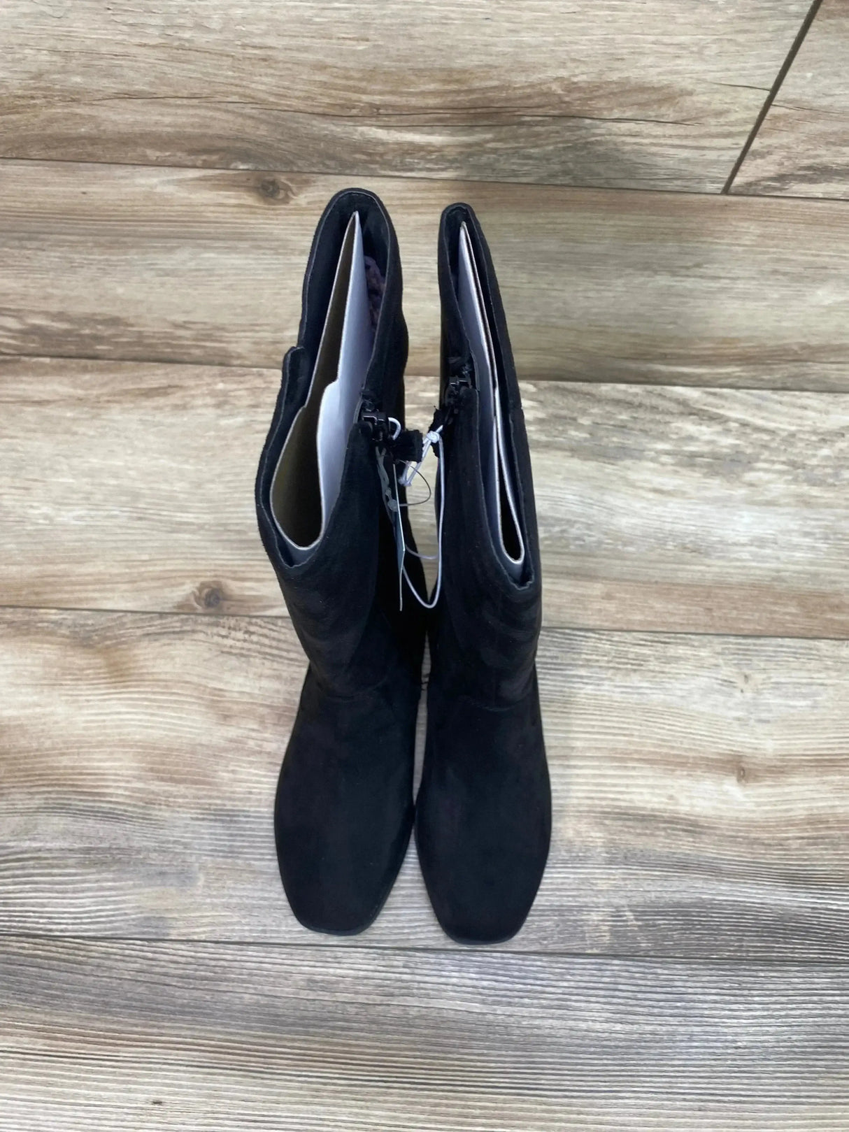 Top-down view of Cat & Jack Mylah tall riding boots in black showing square toe and side zipper on wood floor
