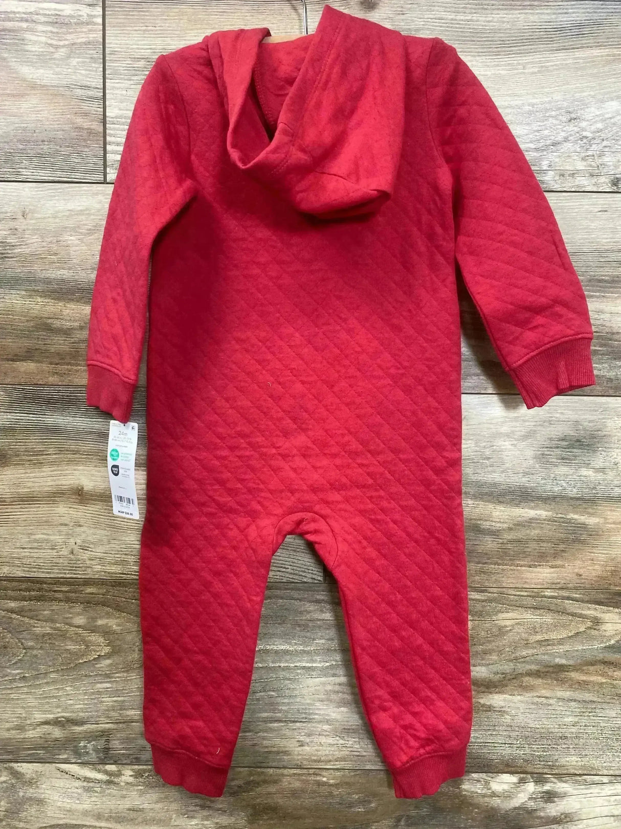 Back view of red Carter's quilted hooded jumpsuit, size 24 months, showing diamond texture and cuffed sleeves on wood