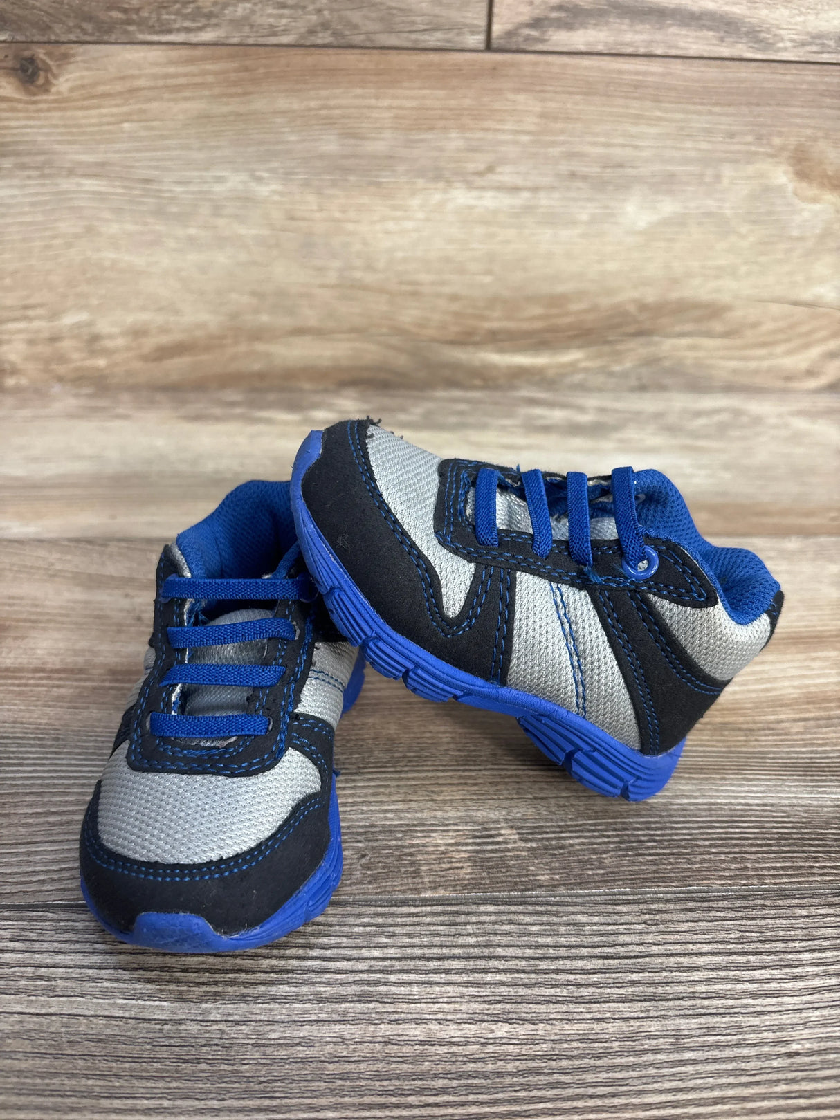 Blue and gray toddler sneakers on wooden floor, kids athletic shoes product image