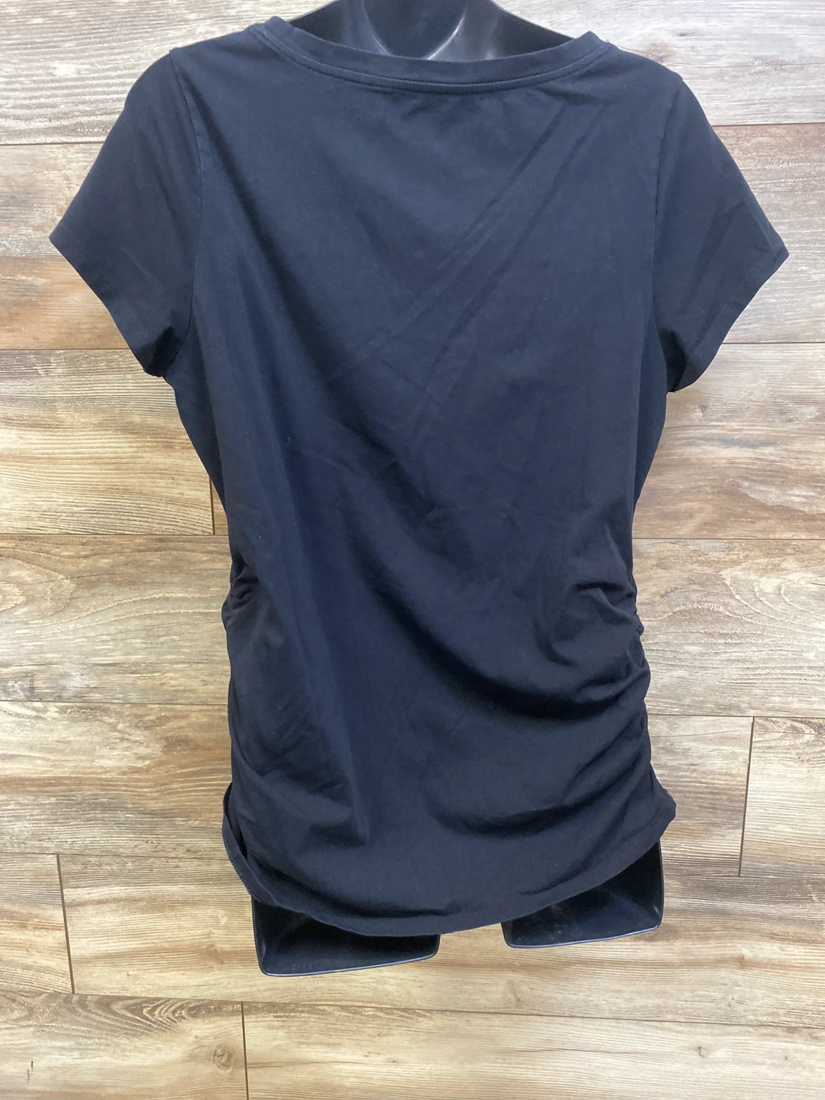 Front view of black Old Navy maternity fitted shirt in size XL showcasing short sleeves and side ruching on a wood floor