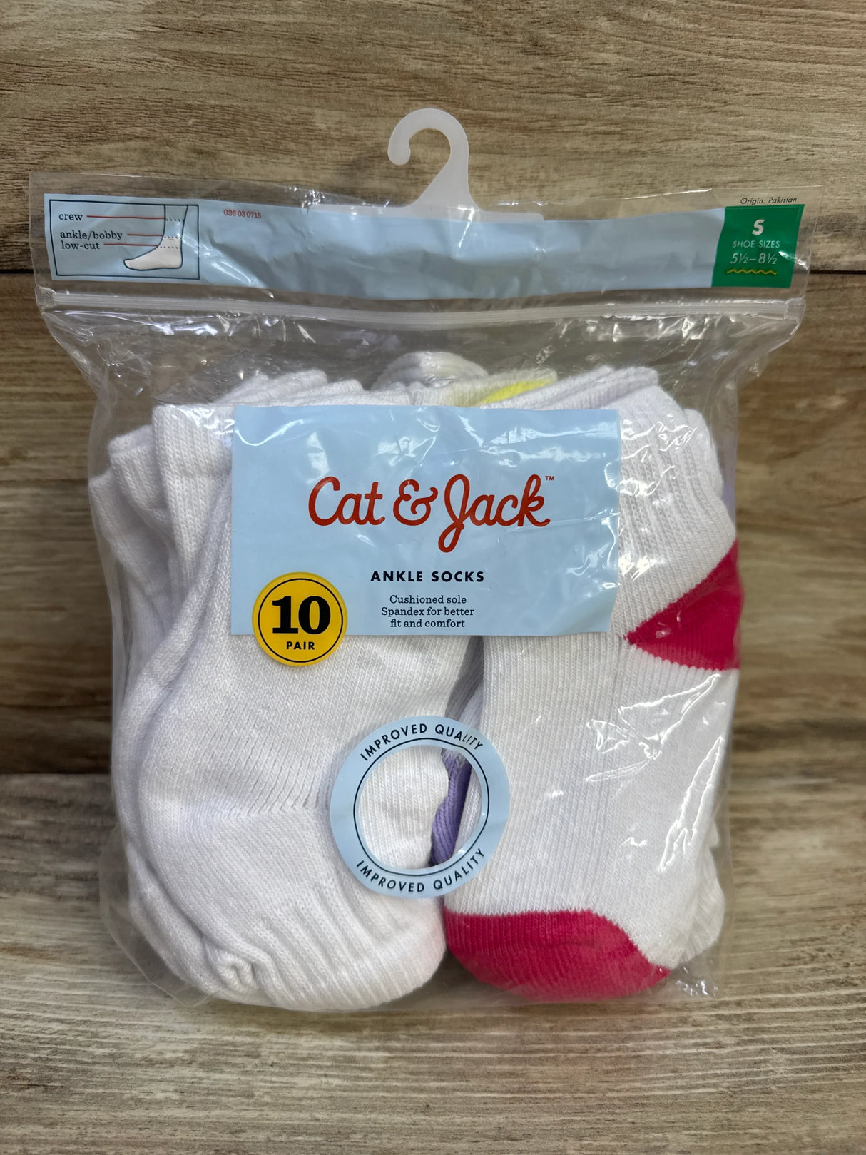Front view of Cat and Jack 10-pair ankle socks package showing label, cushioned sole text and white socks with pink toes