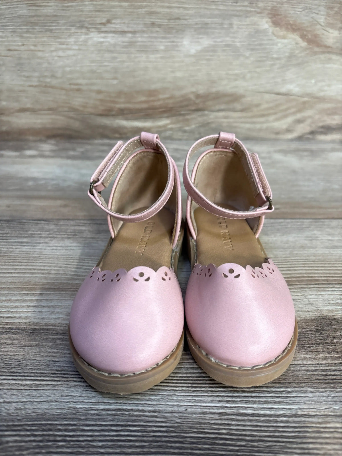 Pair of pink Me n Mommy To Be chunky eyelet-trim ballet flats for toddlers.