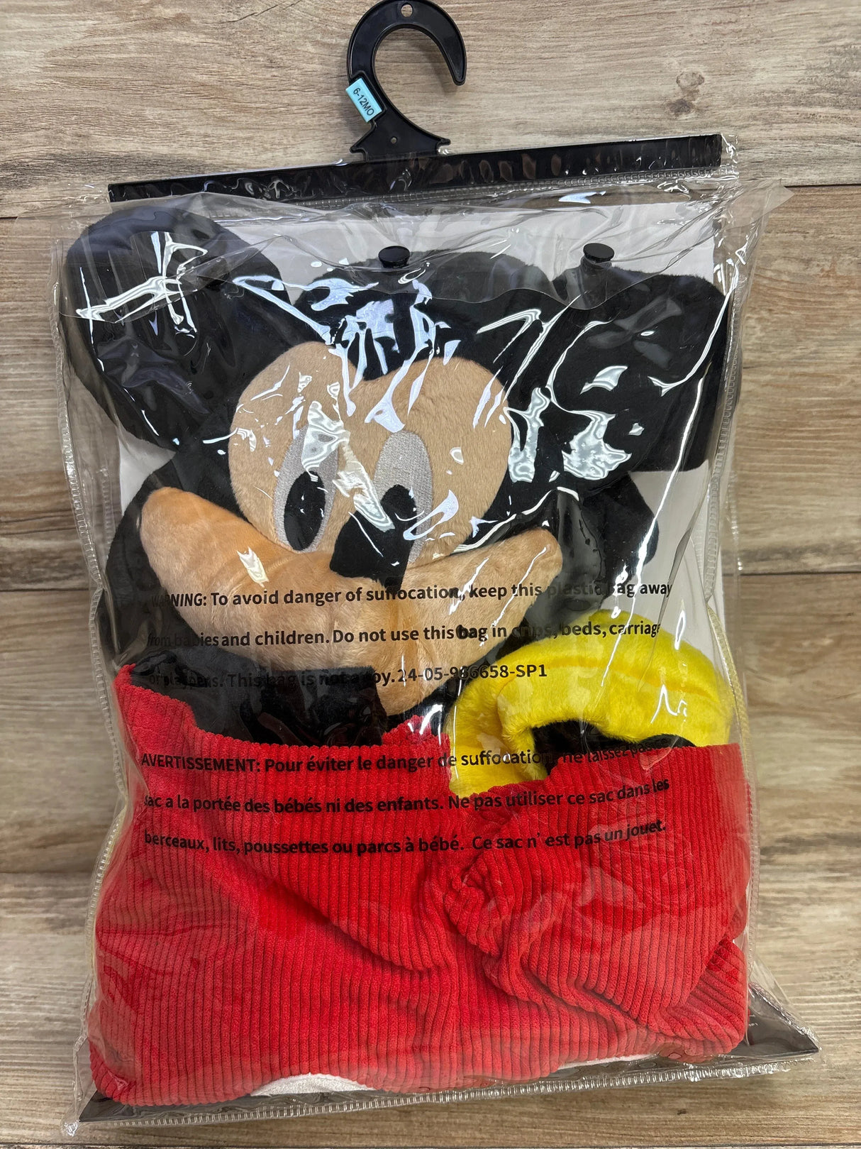 Mickey Mouse plush toy in red outfit, packaged for kids' resale