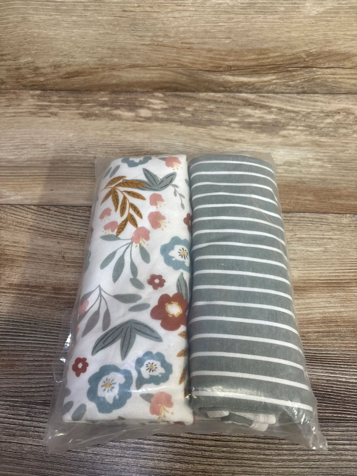 Folded view of 2-pack Momcozy swaddle blankets showcasing soft fabric and generous size on white background